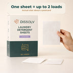 DSSLV laundry detergent sheet held for scale beside the pack. One sheet is up to 2 loads, about postcard size